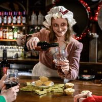 our in character period actor serving drinks at your christmas party in the London Dungeons